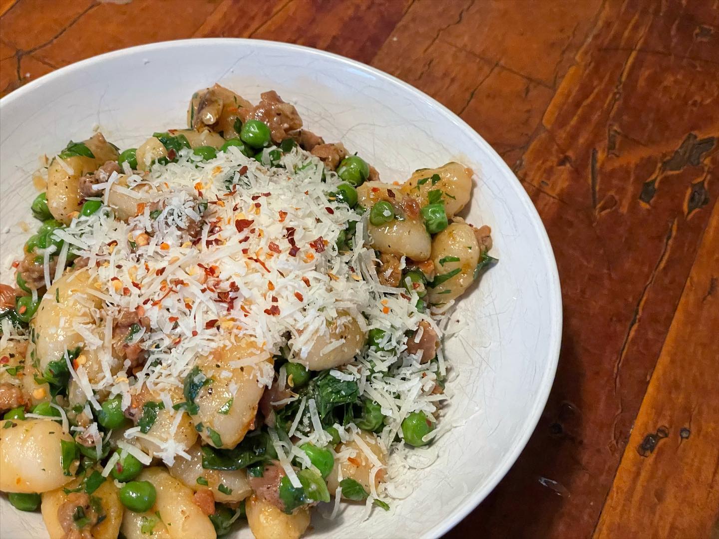 Full size image for Crispy pan fried gnocchi with peas and sausage.